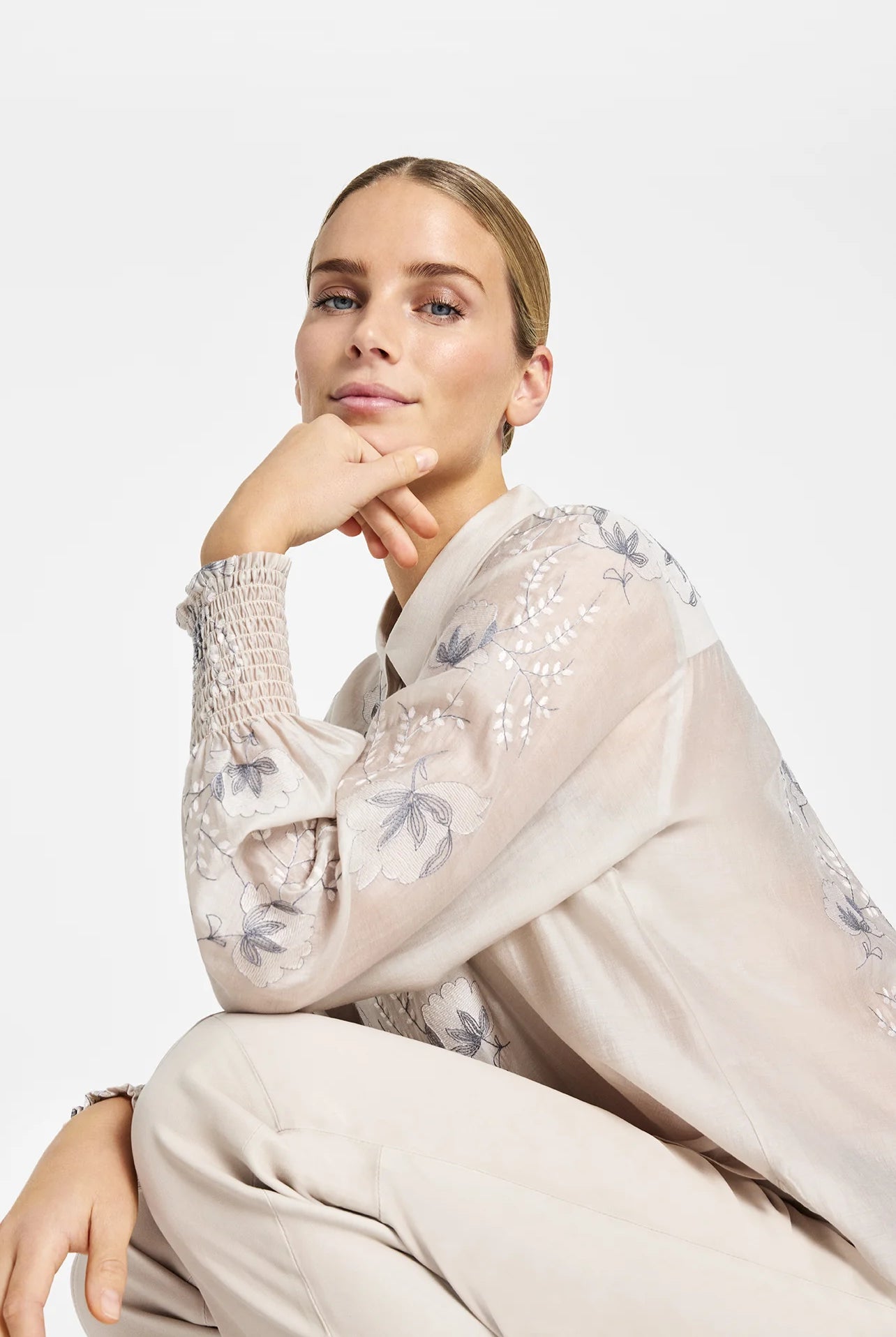 Gustav Bayanna floral motif blouse worn by model, sheer neutral blouse with long sleeves