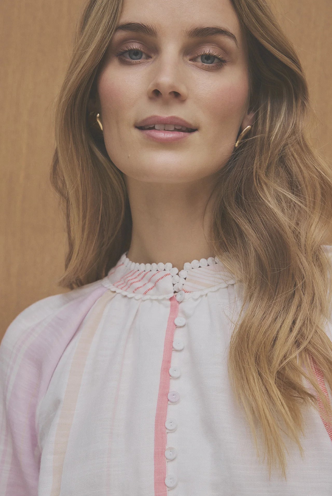 Gustav blouse neckline detail with button front trim