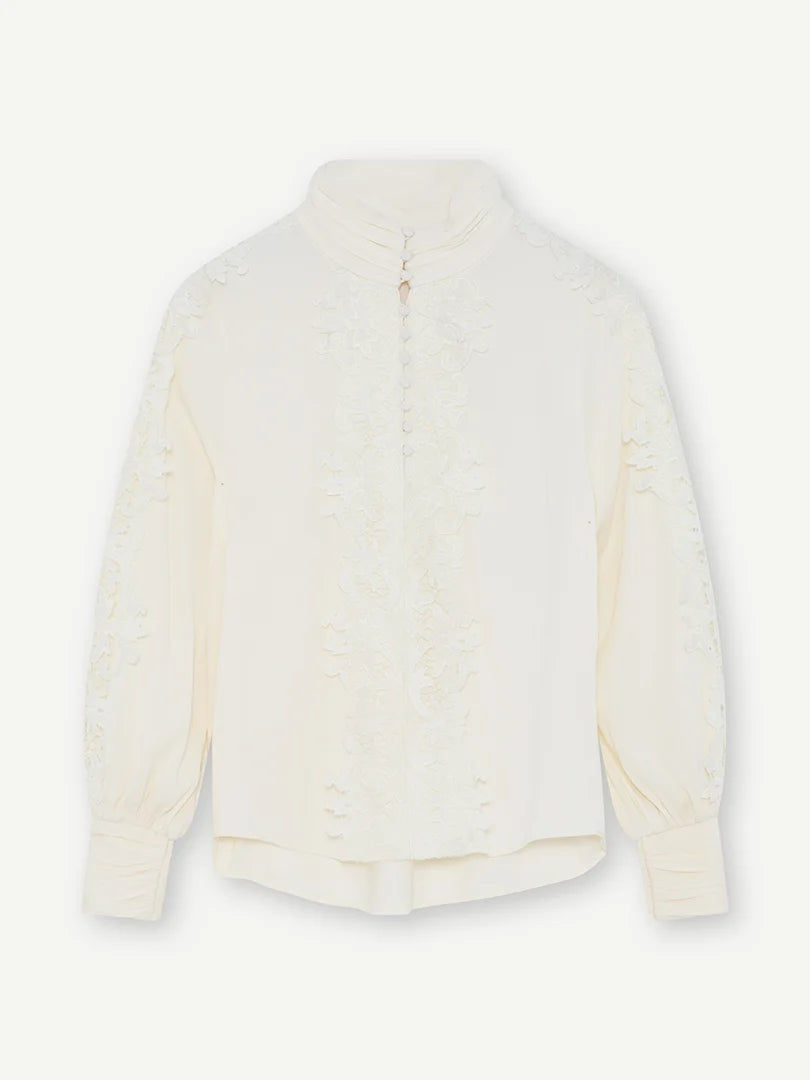 Gustav Cana off-white lace blouse with high neckline, long sleeves and floral lace detailing – back view