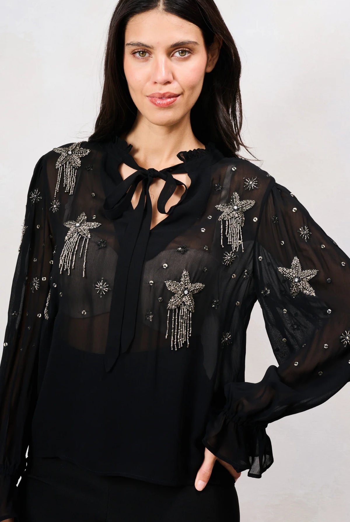 Hope & Ivy Elaris black embellished mesh top with beaded stars – front model close-up
