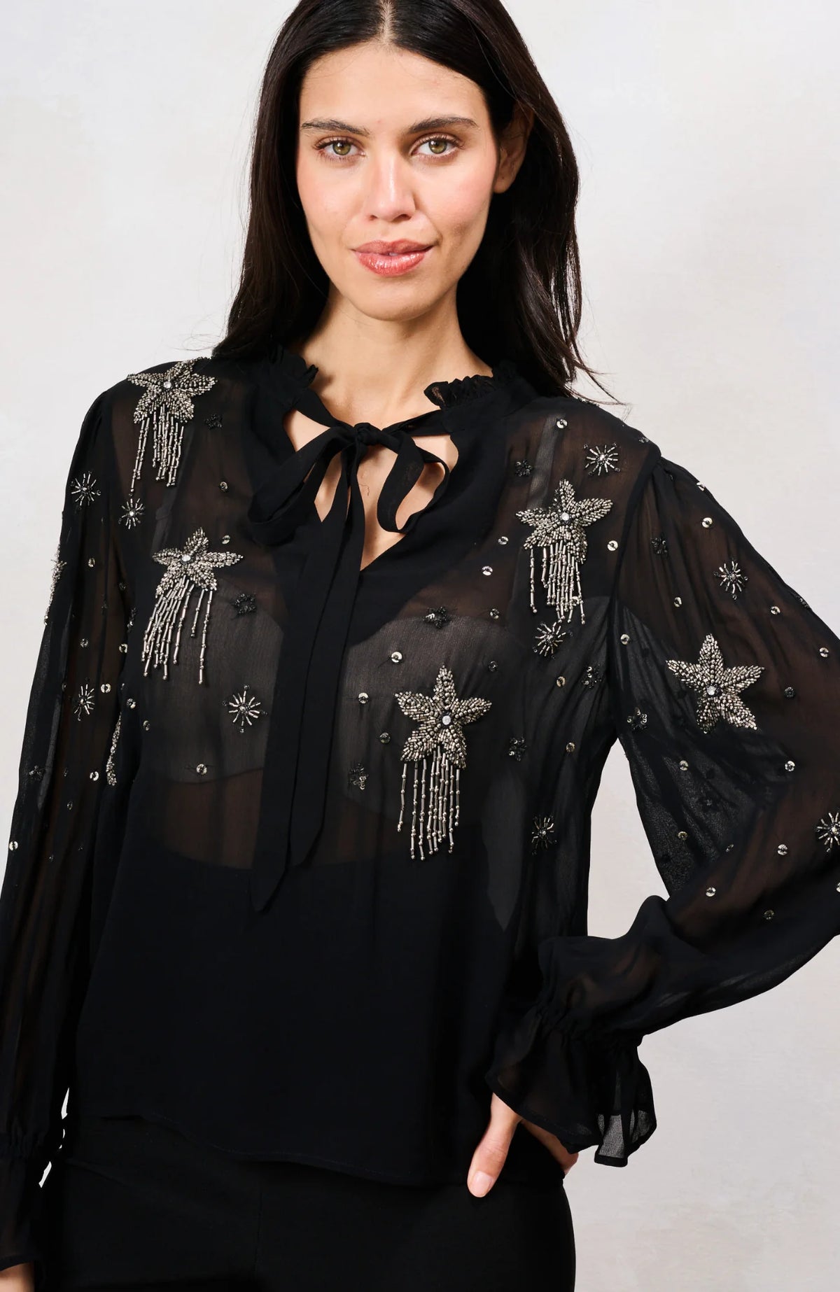 Hope & Ivy Elaris black embellished mesh top with beaded stars – front model close-up
