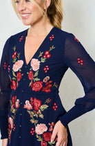 Pink and red floral stitchwork on navy Hope & Ivy V neck dress