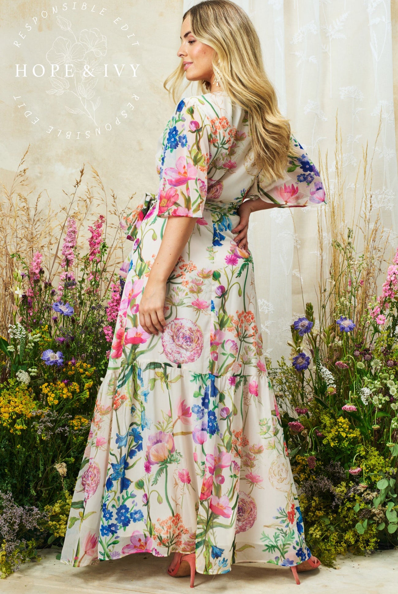 Hope & Ivy Michelle floral maxi dress back view flowing skirt