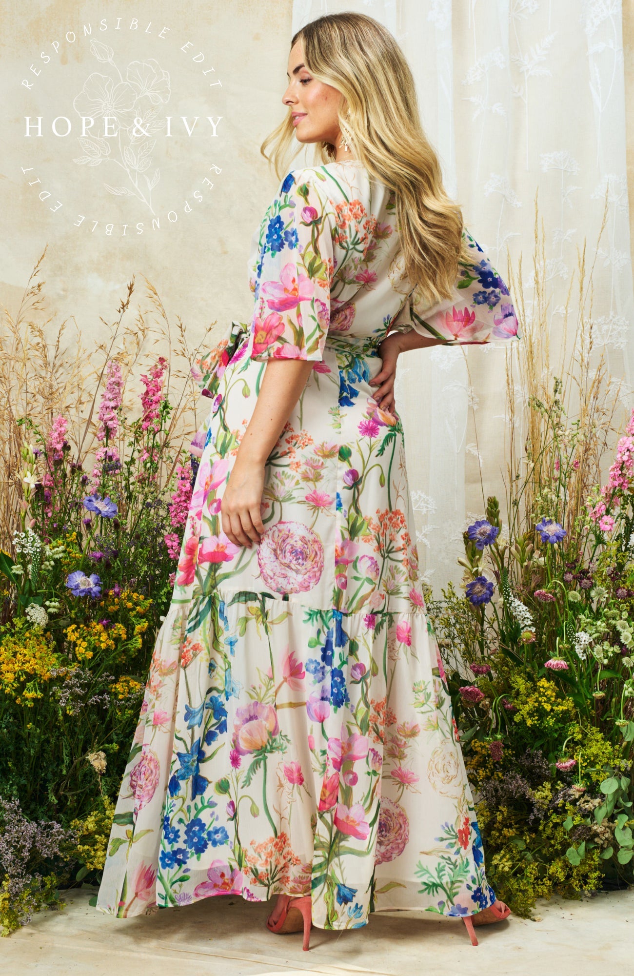 Hope & Ivy Michelle floral maxi dress back view flowing skirt