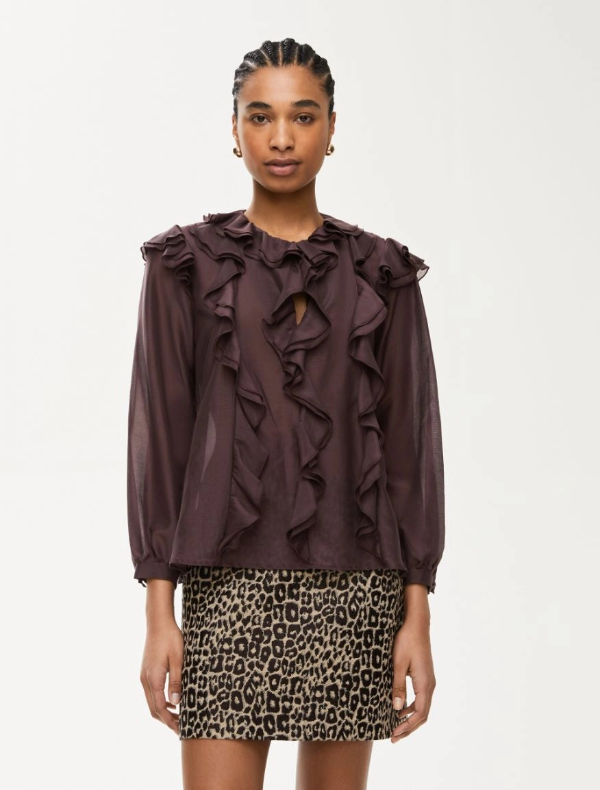 Model wearing burgundy silk blend blouse with front frills by iBlues