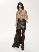 Women’s multi-colour beige loose fit floral blouse styled with black skirt