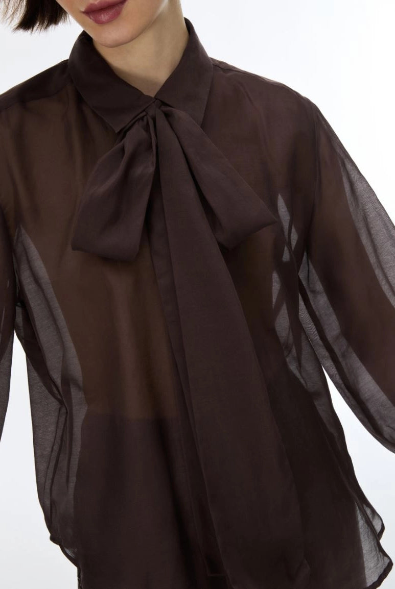 Close-up of iBlues Iblasti chocolate brown sheer blouse with bow neck