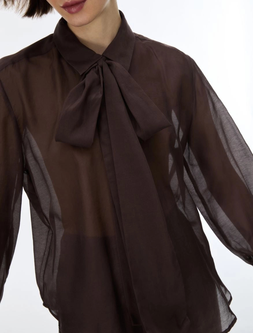 Close-up of iBlues Iblasti chocolate brown sheer blouse with bow neck