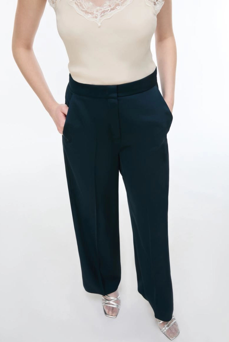 Close-up of iBlues Iblpere dark teal satin trousers with slant pockets