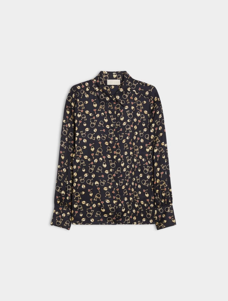 Flat lay of navy long sleeve women’s shirt with playful mini print