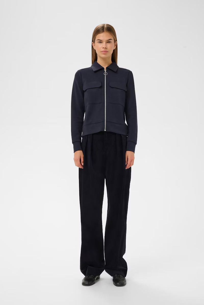 Front view of InWear navy jersey jacket styled with dark trousers