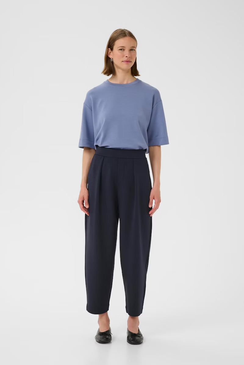 Front view of InWear PannieI navy relaxed fit trousers styled with blue top