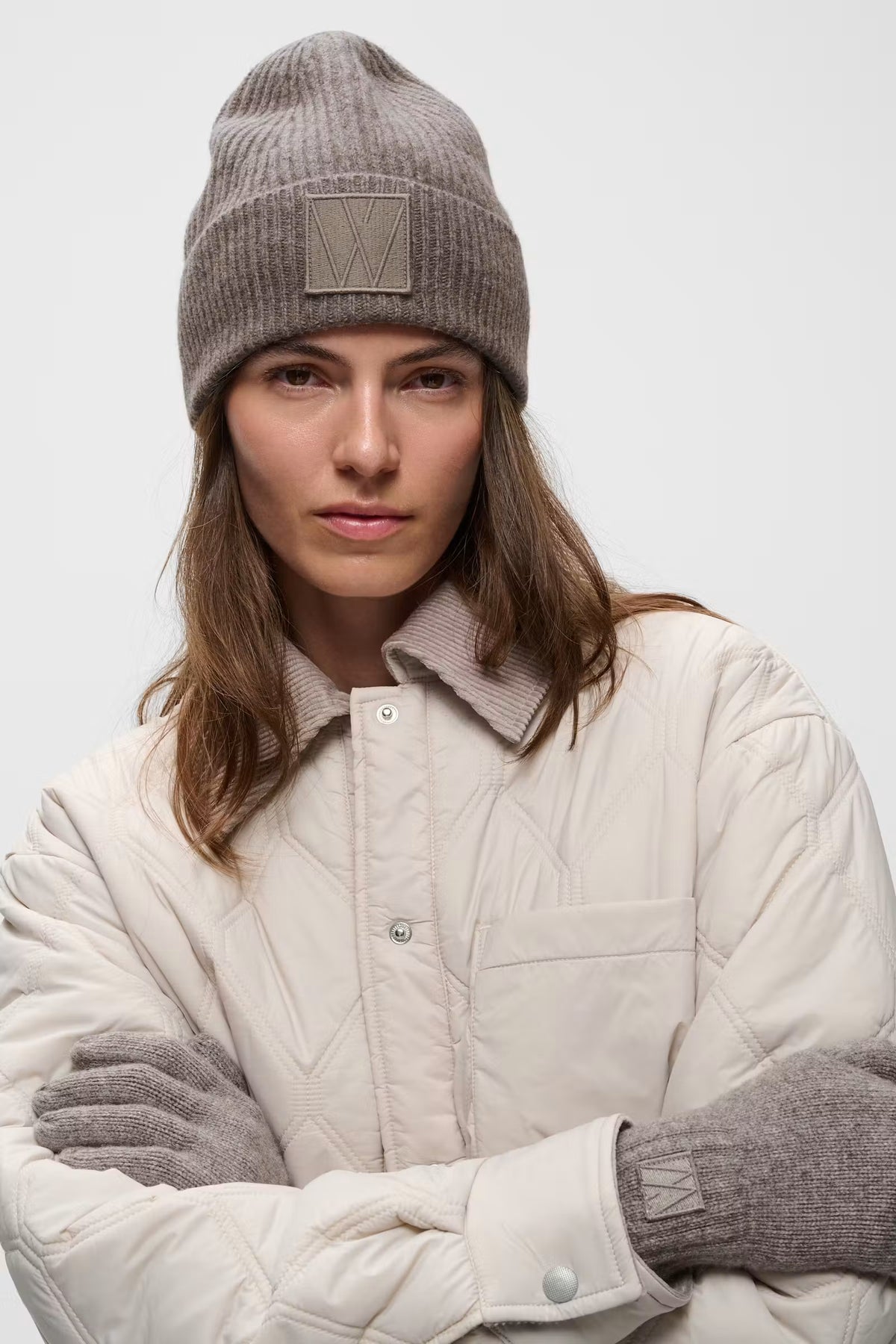 InWear Kaxy Cinder Melange wool beanie styled with cream jacket – model view