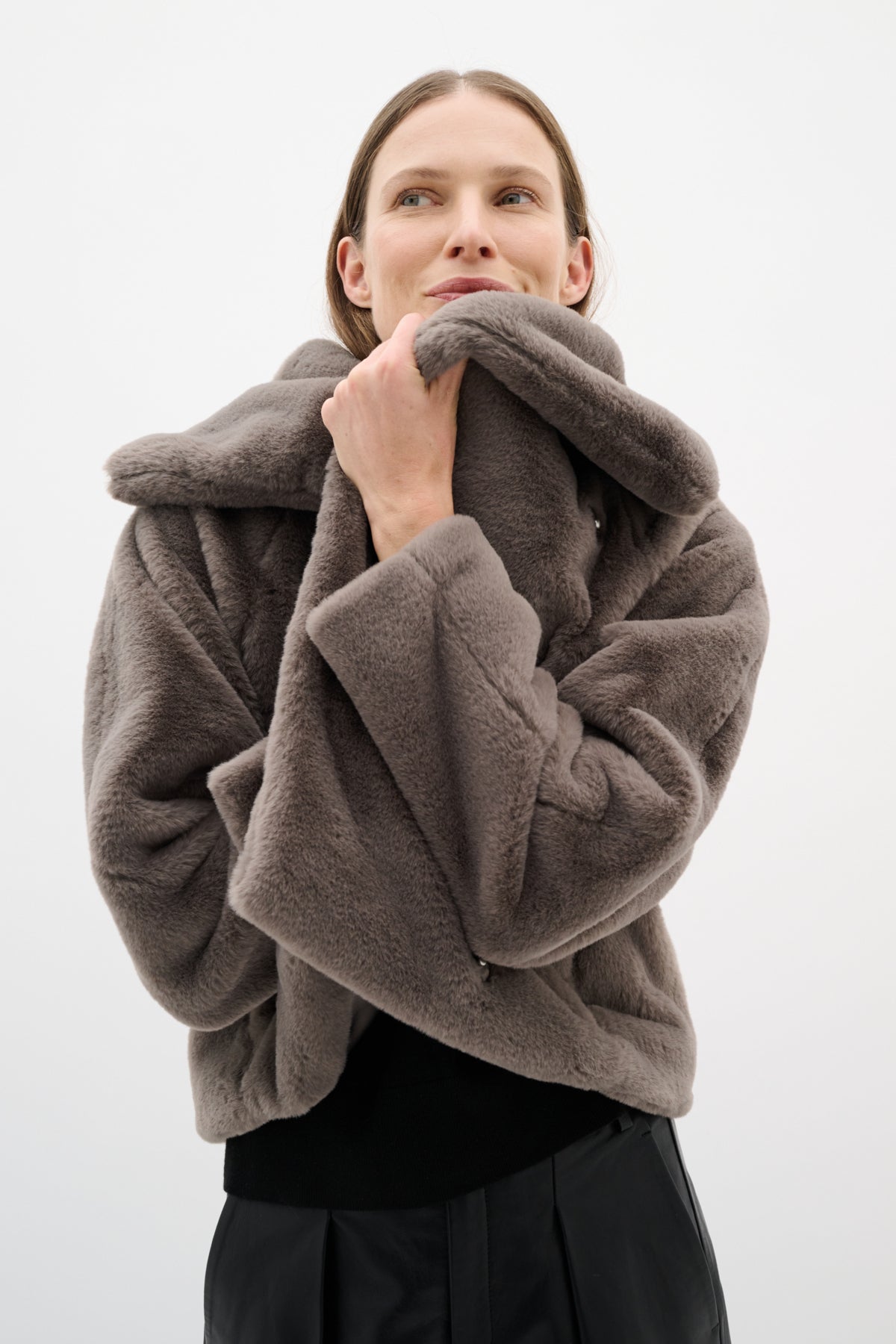 Overhead angle of model wearing InWear grey faux fur jacket with draped collar