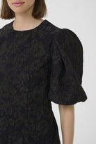 Close-up of puff sleeve and brocade texture on InWear Brill mini dress