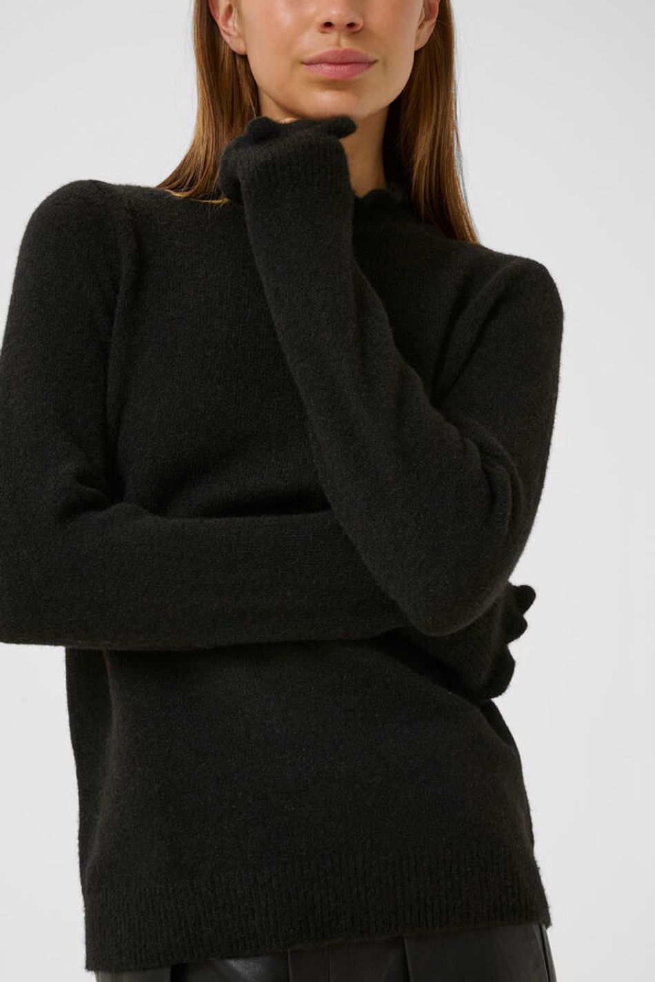 Close-up of black InWear Anaja frill high neck jumper showing sleeve and neckline.
