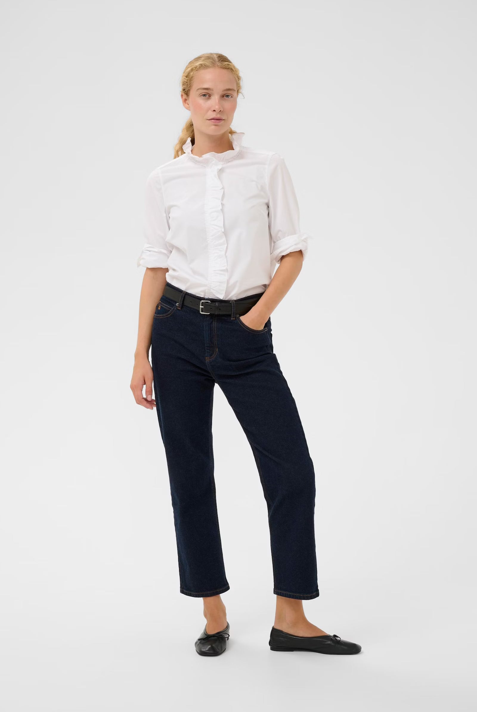 Model wearing InWear white frill shirt with dark straight-leg jeans