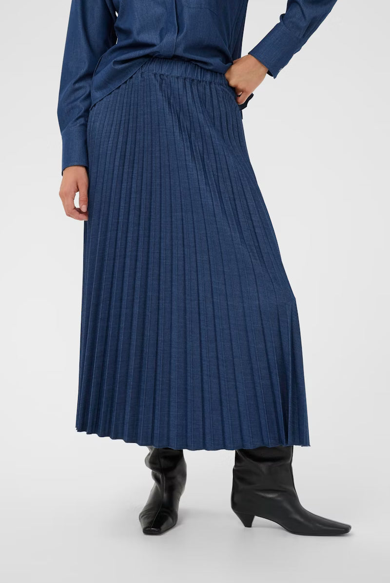 Denim blue pleated maxi skirt styled with coordinating top