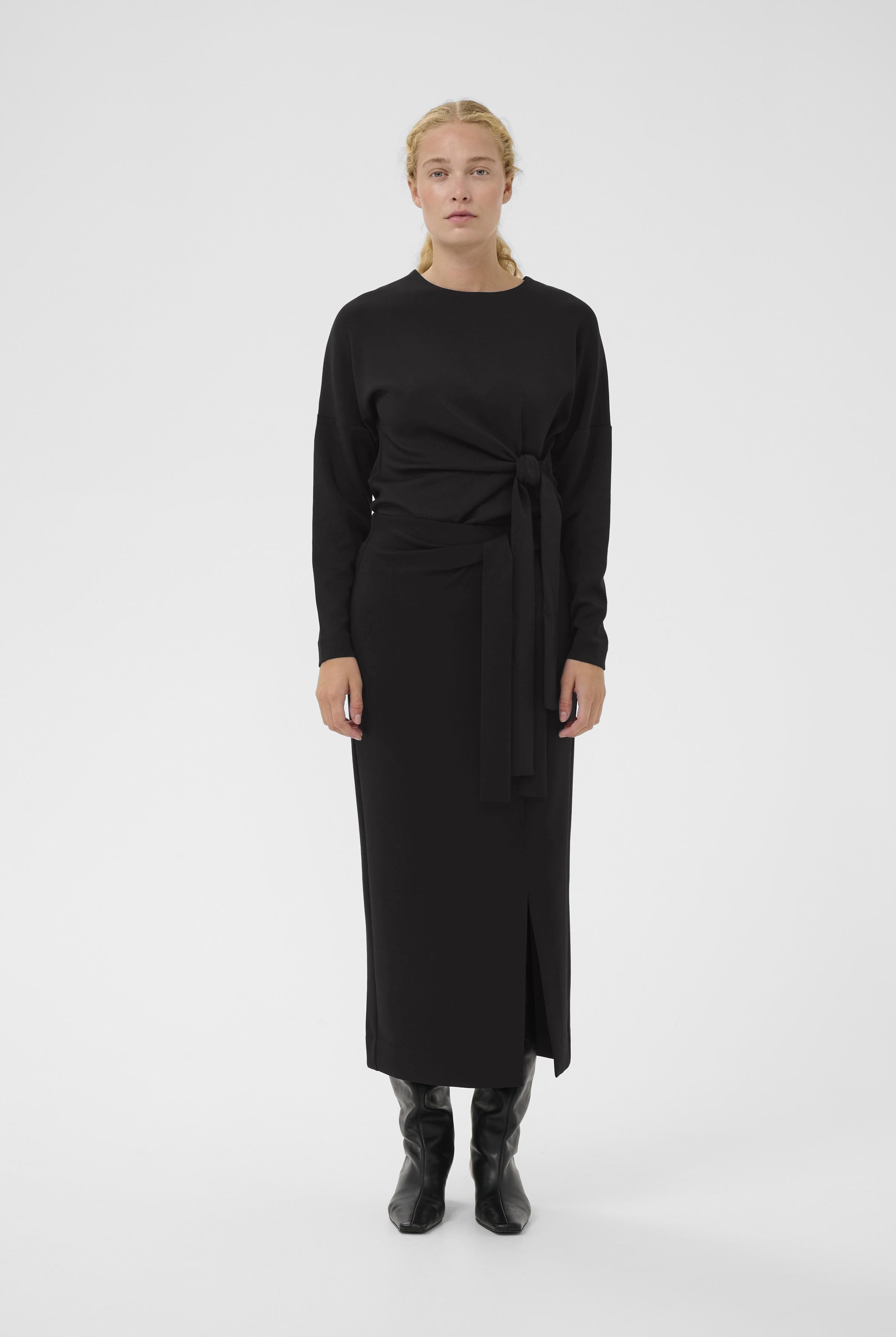 Model wearing InWear Tricenti top and matching matching black skirt