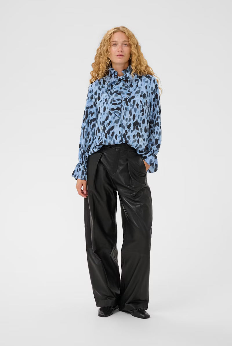 InWear Gracie blue animal print blouse styled with black wide-leg trousers