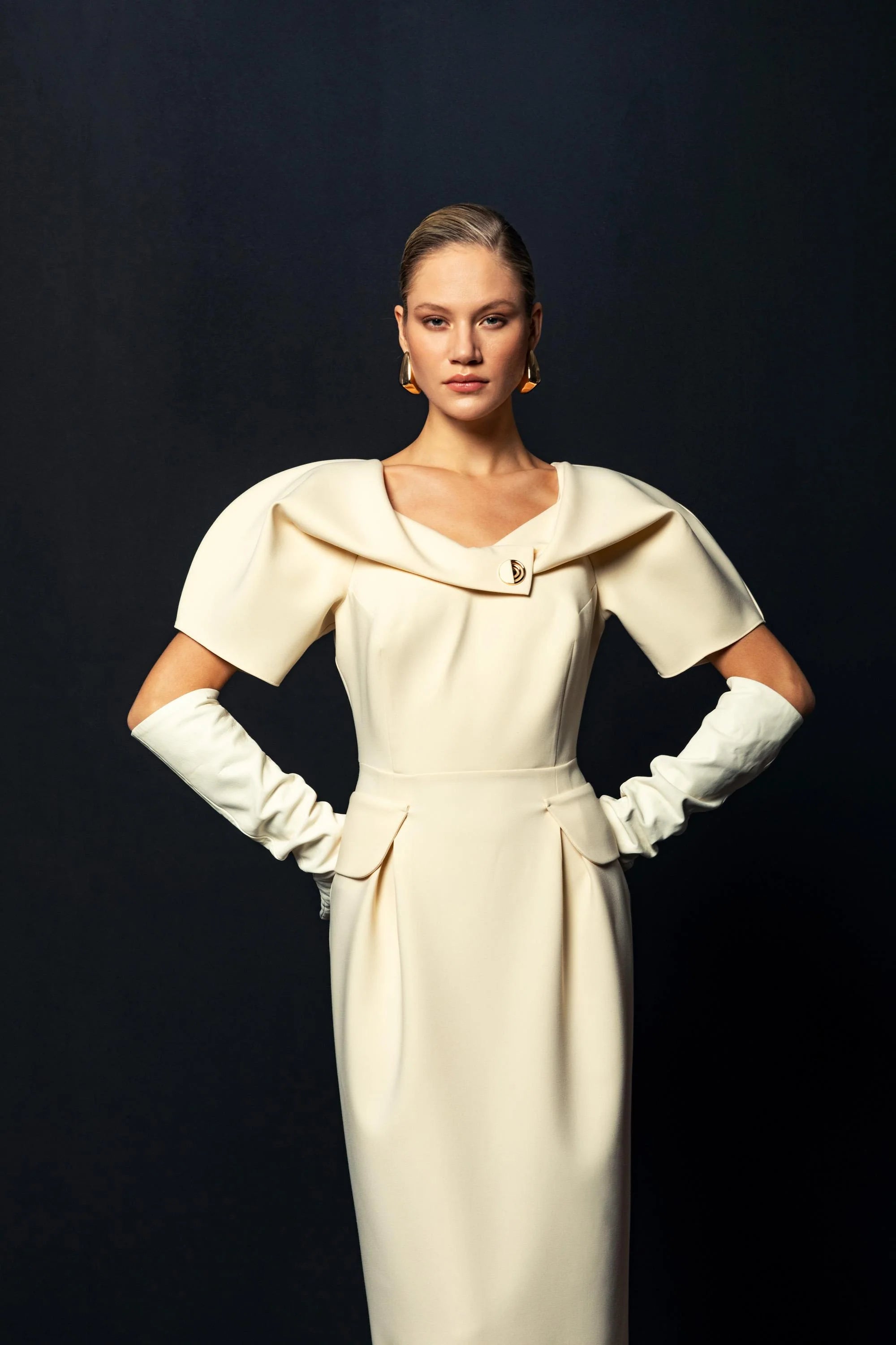 Close-up of neckline and draped shoulder detail on Kameya Draped Shoulder Midi Dress