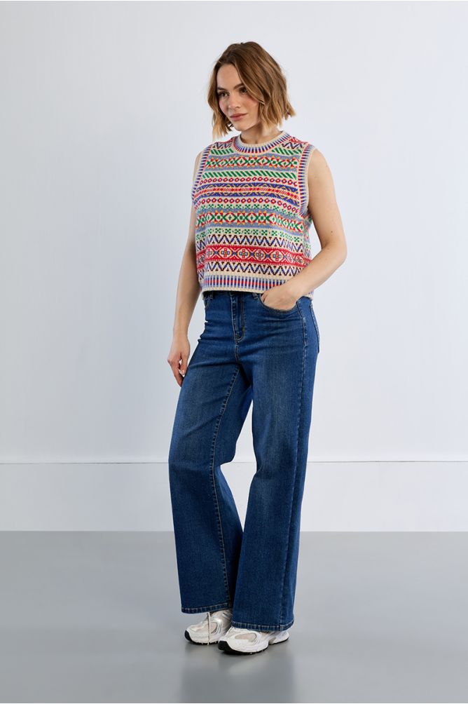 Lili Sidonio geometric sleeveless knit jumper styled with blue jeans