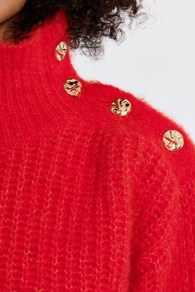 Lili Sidonio red fluffy jumper gold-tone shoulder button detail close-up
