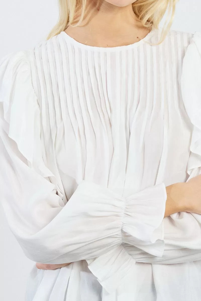 Lilli Sidinio Victorian-inspired white blouse with soft pleats and ruffle trim