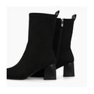Back and inner-zip view of Lodi Heka black suede ankle boots with block heel.