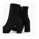 Black suede Laira high heel boots, rear/inner-zip detail.