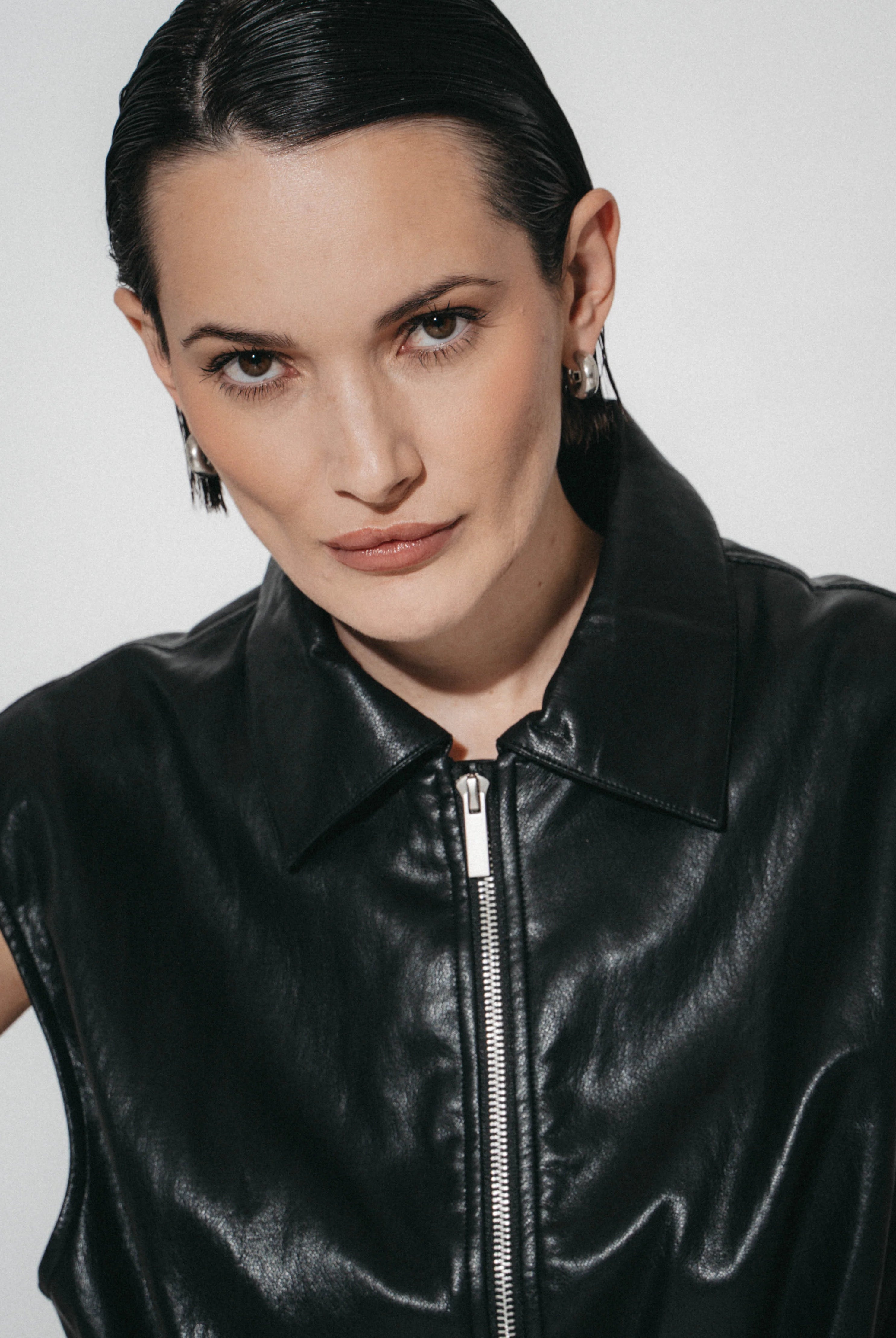 Luje Alora black faux leather sleeveless jacket close-up showing collar and zip