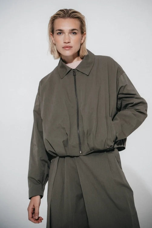 Luje Blaze khaki pleated bomber jacket front view on model