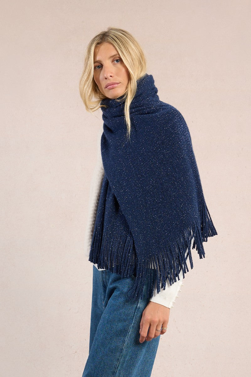 Side view of Molly Bracken navy fringed women’s scarf styled with jeans and white top