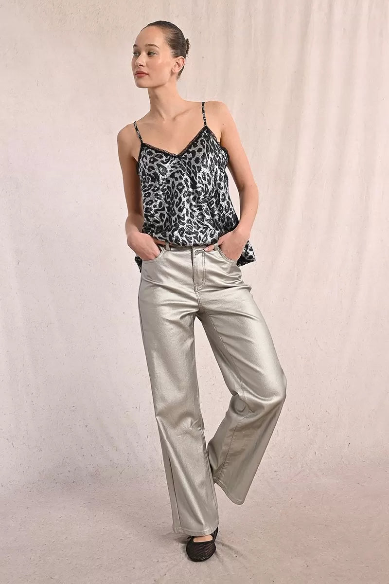 Model wearing Molly Bracken silver wide-leg coated jeans with printed top