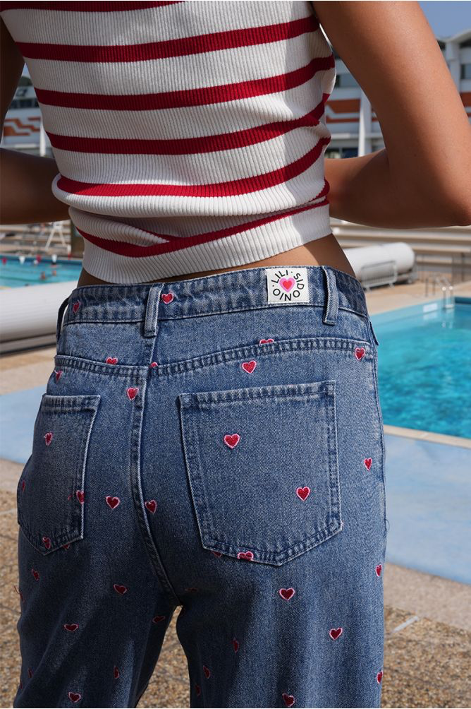 Molly Bracken blue denim wide leg jeans with red heart embroidery back view