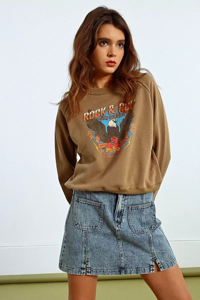 Model in Molly Bracken vintage-style Rock & Roll sweatshirt, relaxed look