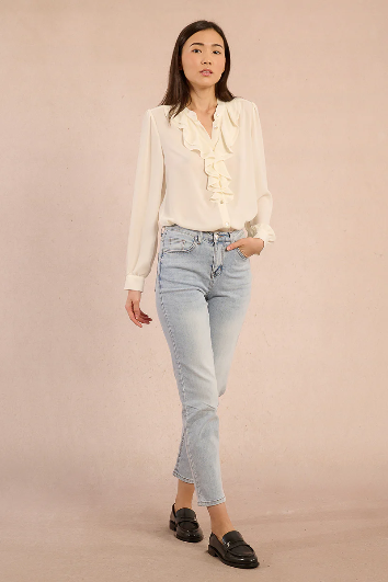 Molly Bracken cream blouse styled with jeans, full outfit view