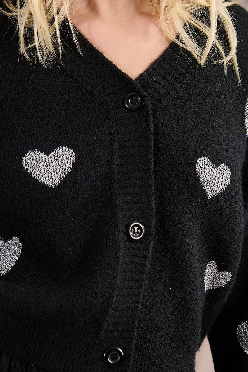 Close-up of Molly Bracken black heart cardigan buttons