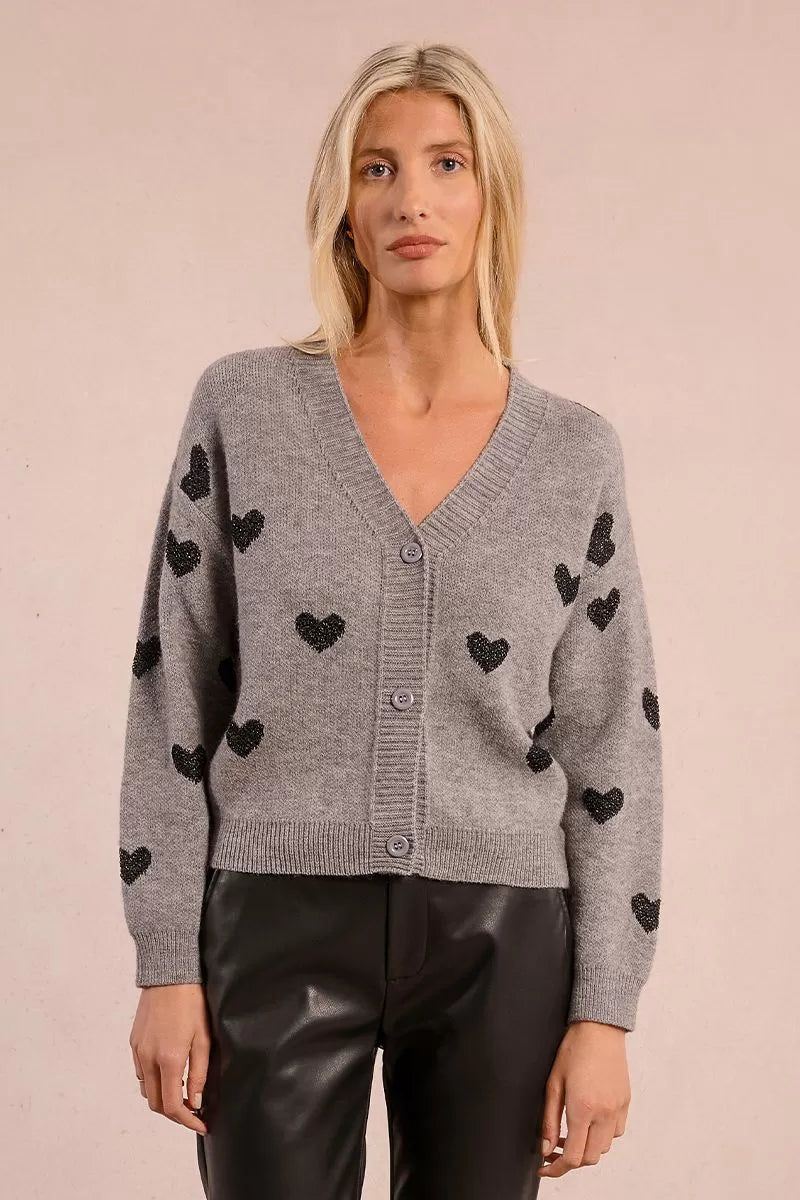 Model wearing Molly Bracken grey heart motif knitted cardigan with leather trousers