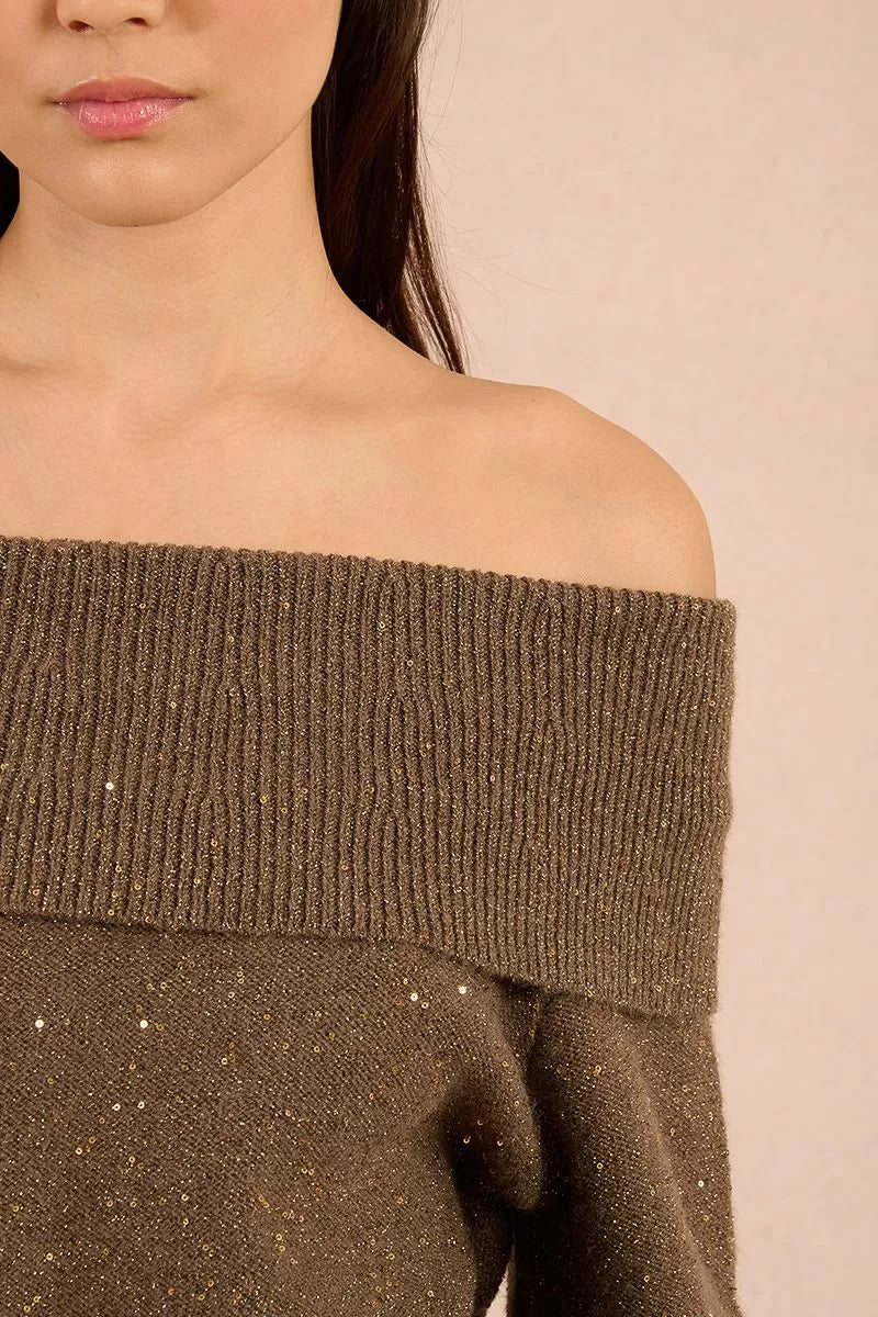 Close-up of khaki knit jumper with sequin detail and off-shoulder neckline