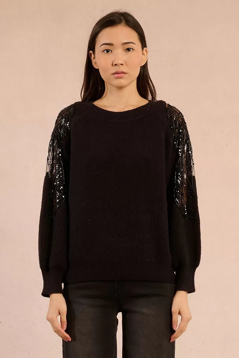 Model wearing black Molly Bracken sweater with lace shoulders and balloon sleeves