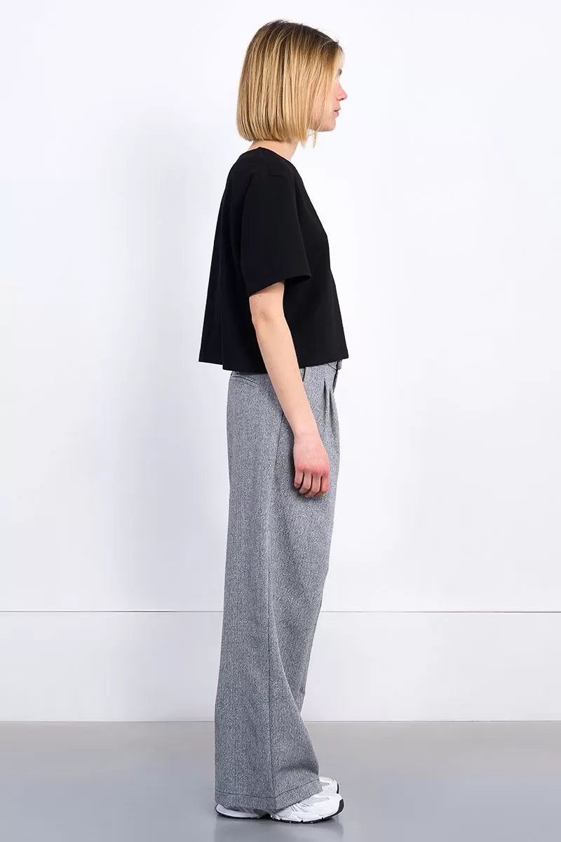 Molly Bracken short sleeve black top paired with denim