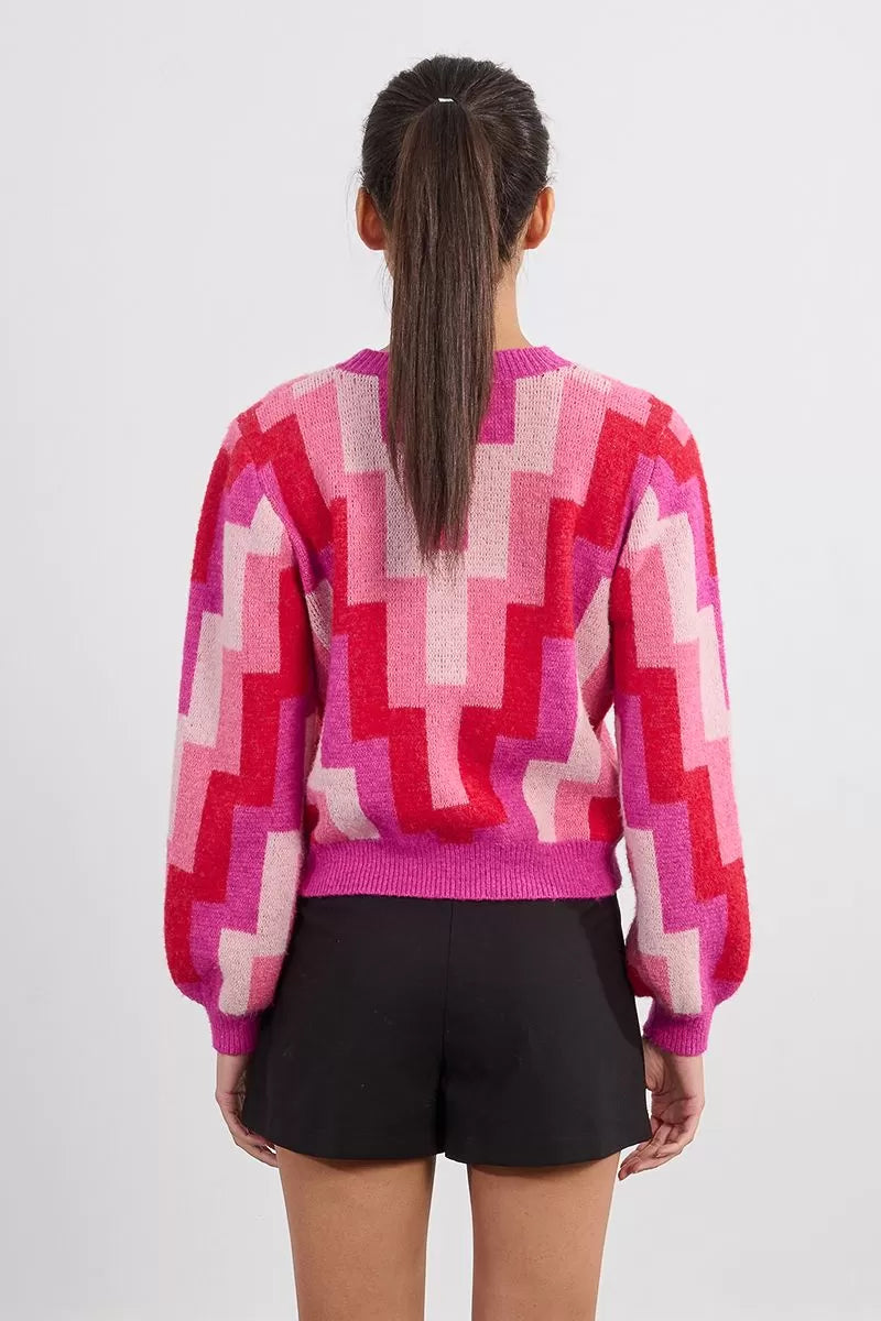 Back of Molly Bracken geometric knit jumper in pink and red