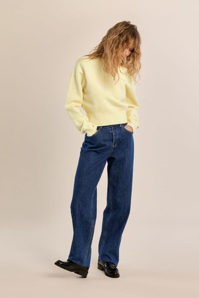 Molly Bracken women’s yellow cropped knit jumper styled with blue jeans