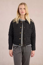 Molly Bracken quilted black jacket with floral stitching, front view
