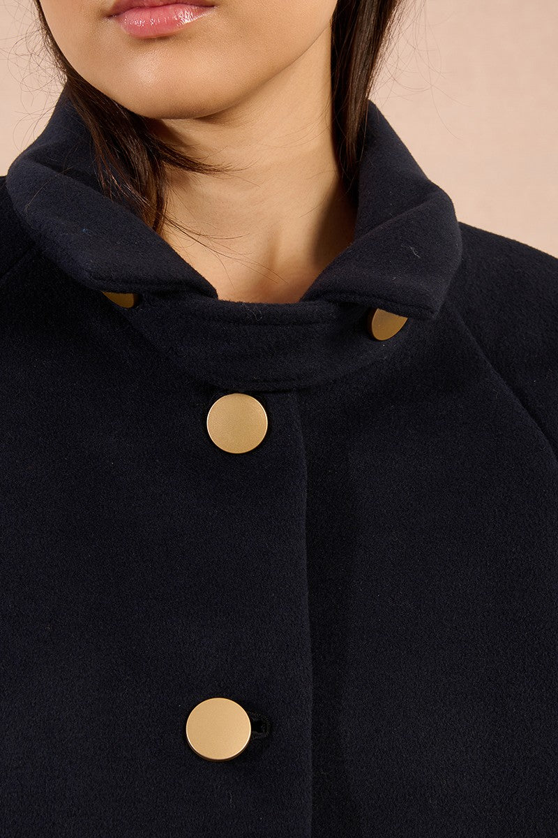 Detail of gold-tone buttons on Molly Bracken long navy coat