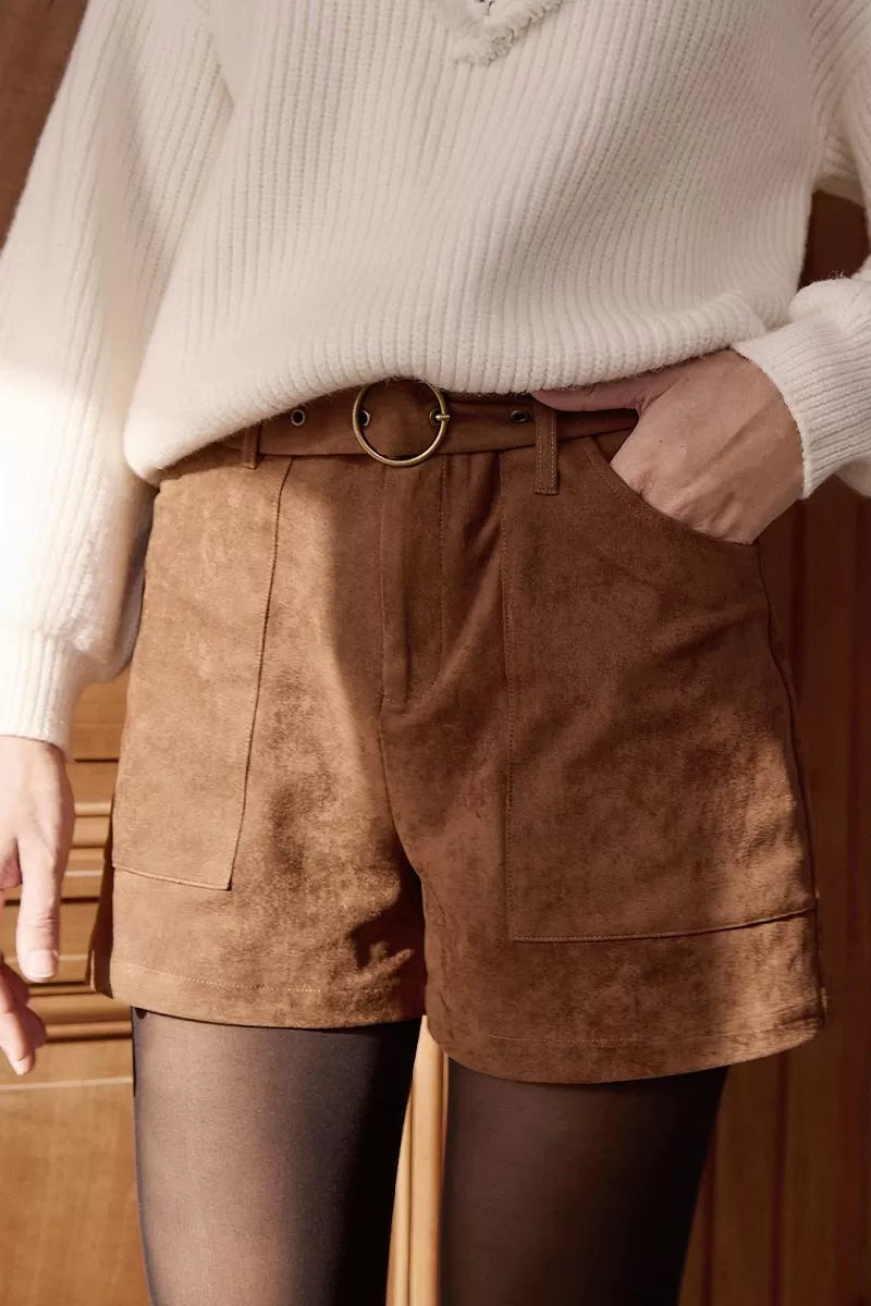 Close-up of Molly Bracken brown faux suede high-waist shorts with buckle belt.