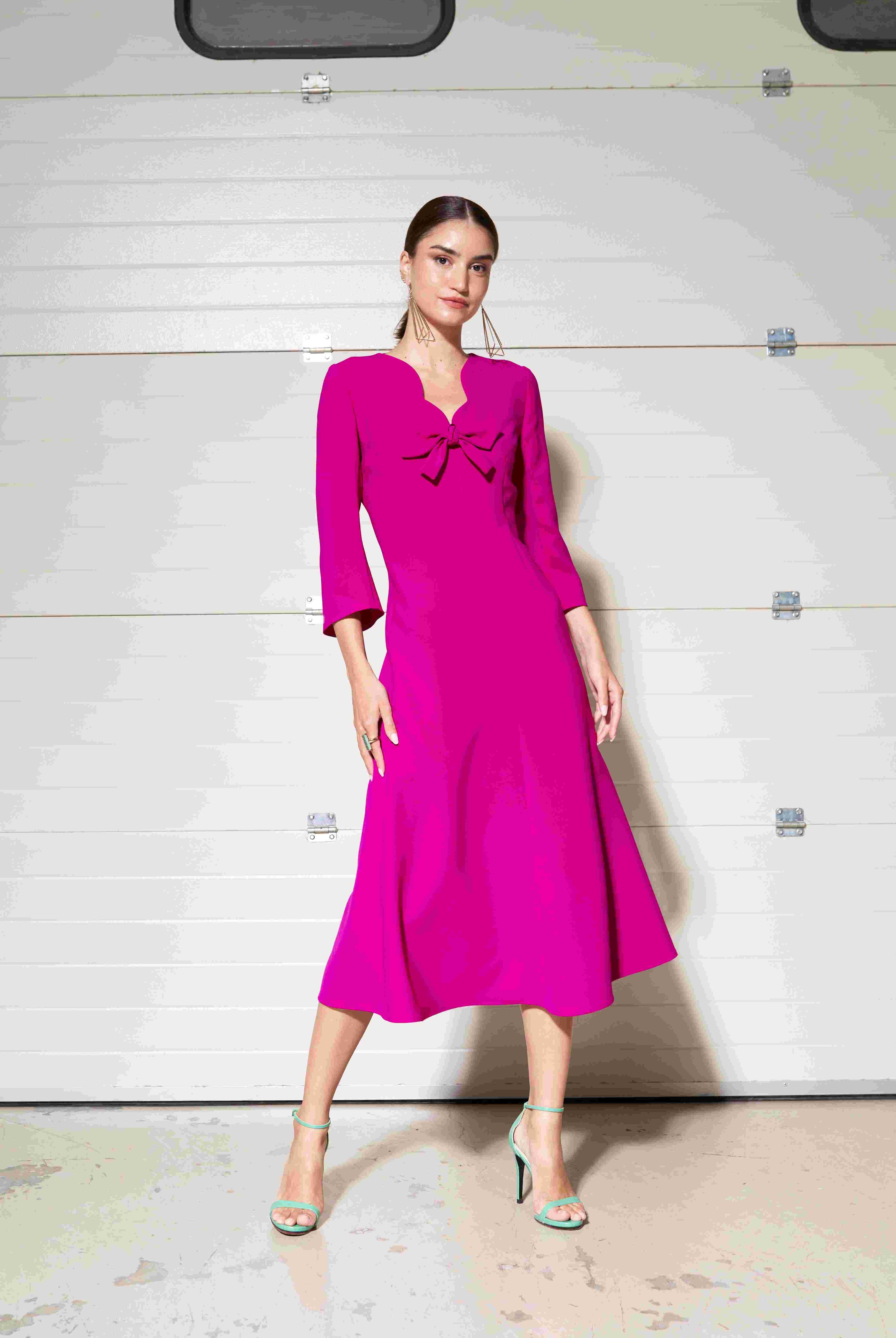 Moskada fuchsia pink bow front A-line midi occasion dress front view