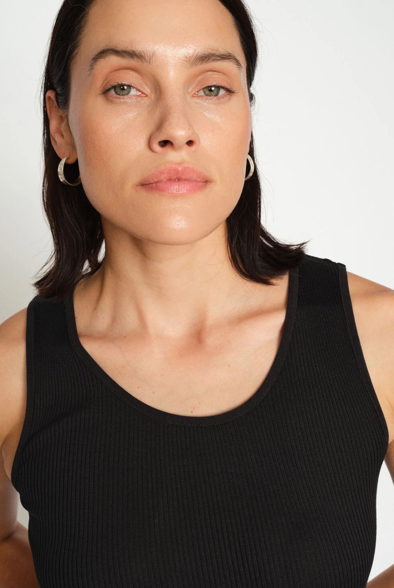 Close-up of Mos Mosh black ribbed tank with round neckline