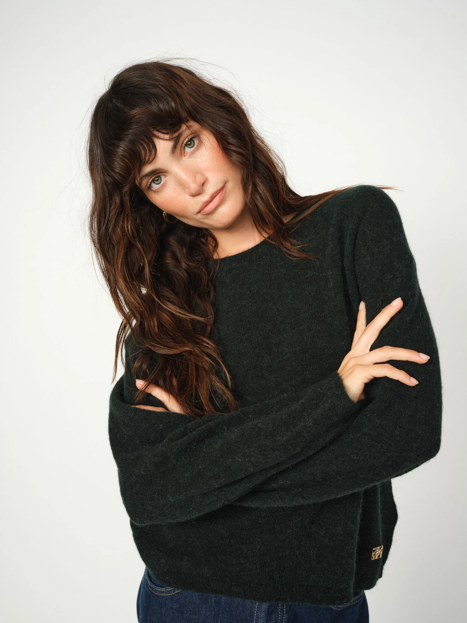 Close-up of scarab green wool texture on Mos Mosh Mape jumper